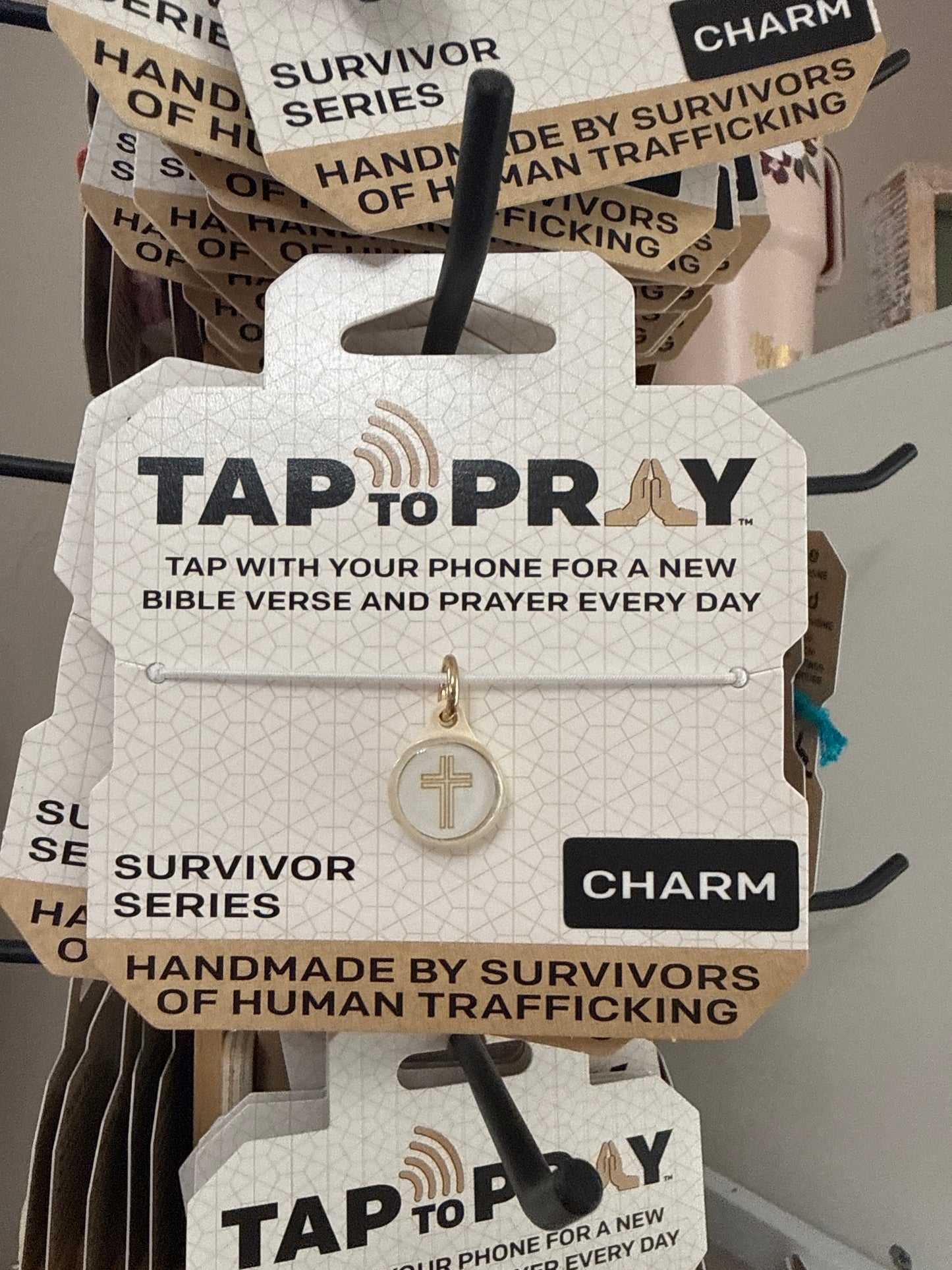 Tap to pray Survivor Series charm